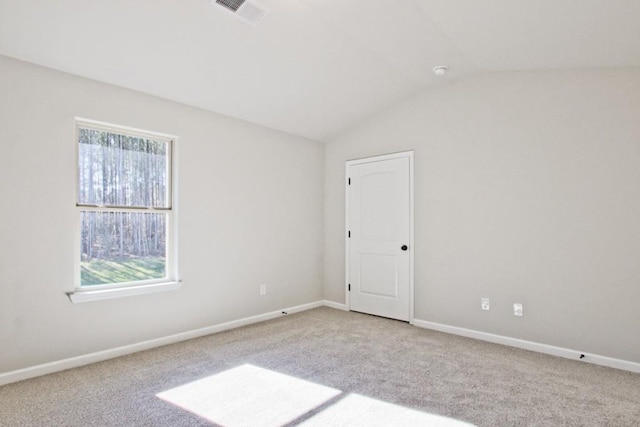 238 Linford Dr, Locust Grove, GA 30248 - carpeted spare room featuring healthy amount of natural light, vaulted ceiling, and baseboards