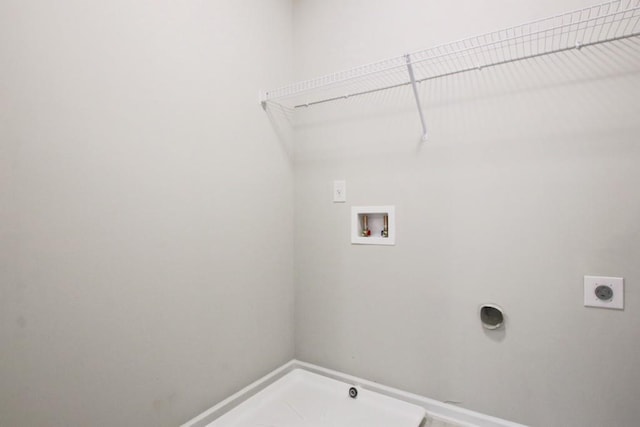 238 Linford Dr, Locust Grove, GA 30248 - laundry room featuring electric dryer hookup, hookup for a washing machine, and baseboards