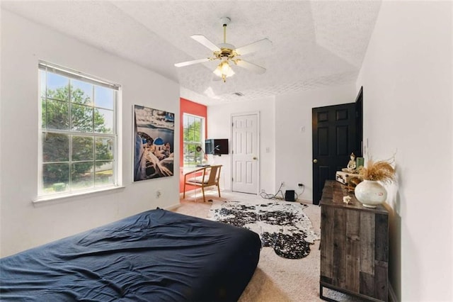 1689 Camden Forrest Way, Riverdale, GA 30296 - carpeted bedroom featuring a textured ceiling and ceiling fan