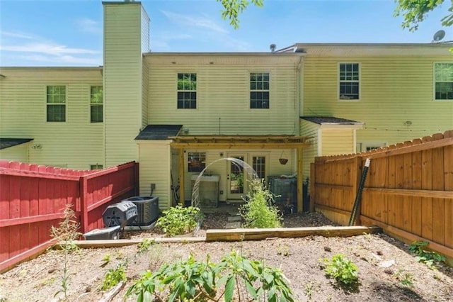 1689 Camden Forrest Way, Riverdale, GA 30296 - rear view of property with a chimney and a fenced backyard