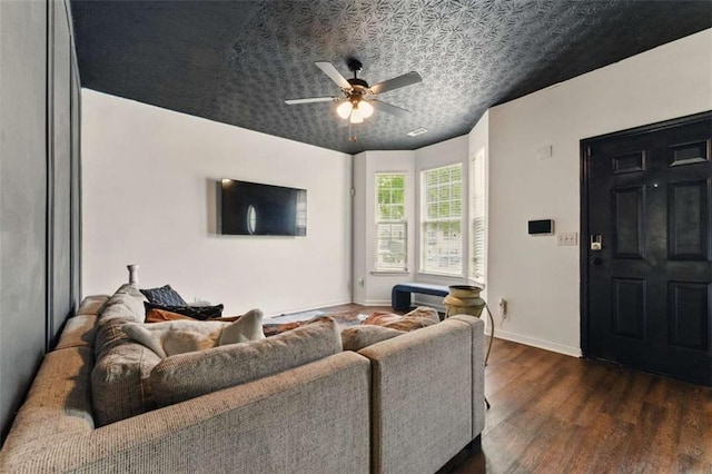 1689 Camden Forrest Way, Riverdale, GA 30296 - living area with dark wood-style floors, ceiling fan, baseboards, and an ornate ceiling