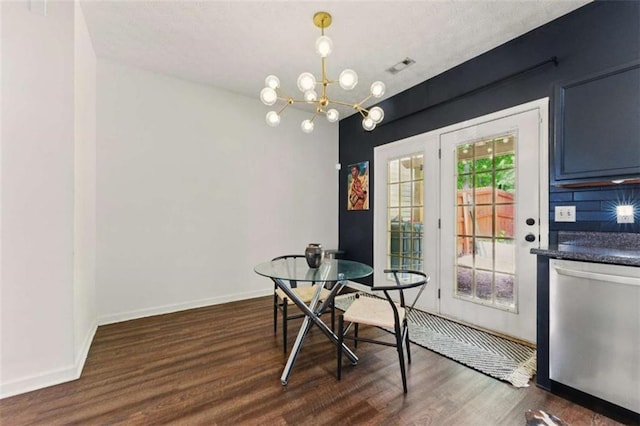 1689 Camden Forrest Way, Riverdale, GA 30296 - dining space featuring dark wood finished floors, baseboards, and a chandelier