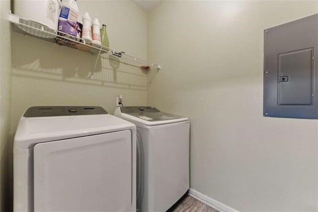 1689 Camden Forrest Way, Riverdale, GA 30296 - laundry room featuring electric panel, washer and dryer, and baseboards