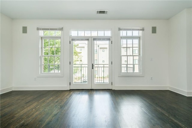 doorway with dark hardwood / wood-style floors and french doors