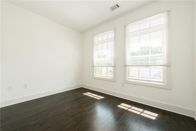 unfurnished room featuring dark hardwood / wood-style floors