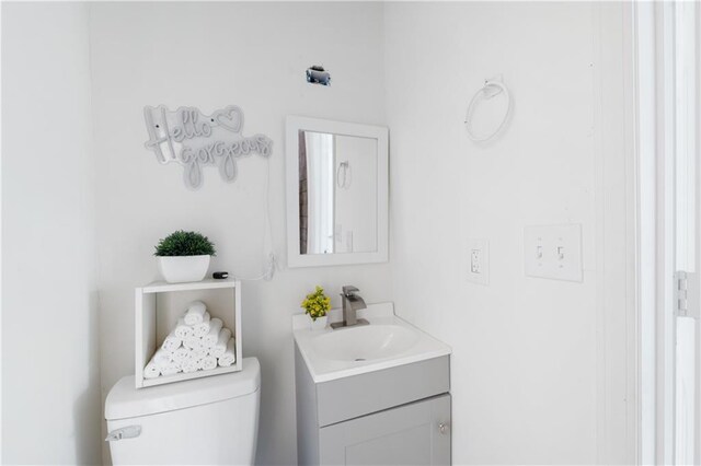 bathroom with vanity and toilet