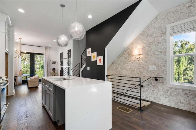2328 Mason Dr, Atlanta, GA 30316 - kitchen with visible vents, french doors, brick wall, and dark wood-style floors
