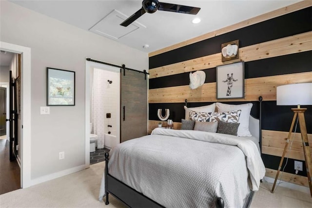 2328 Mason Dr, Atlanta, GA 30316 - carpeted bedroom featuring ensuite bathroom, baseboards, and a barn door