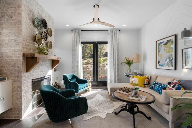 2328 Mason Dr, Atlanta, GA 30316 - living area with recessed lighting, ceiling fan, wood finished floors, and a brick fireplace