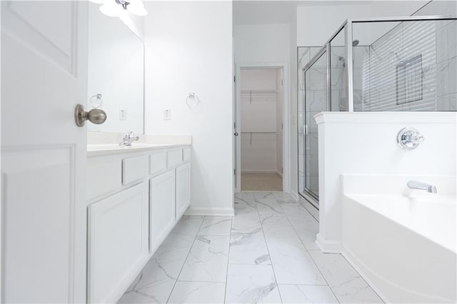 3277 Wyesham Cir, Duluth, GA 30096 - full bath with marble look tiles, a shower stall, a walk in closet, and vanity