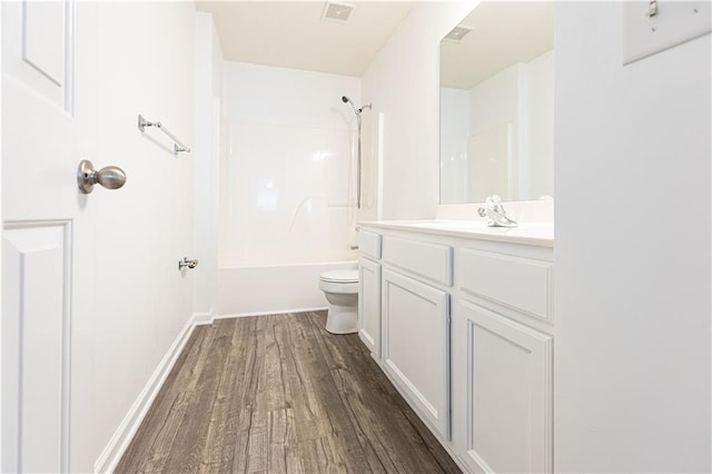 3277 Wyesham Cir, Duluth, GA 30096 - full bathroom featuring toilet, wood finished floors, vanity, and tub / shower combination