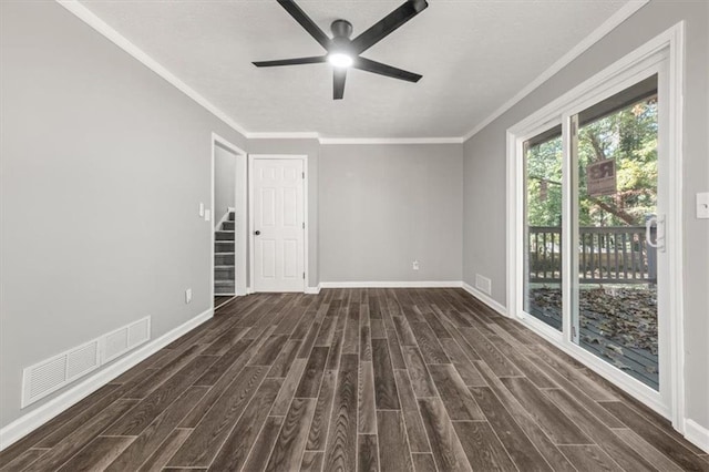 unfurnished room featuring ornamental molding, ceiling fan, and dark wood-type flooring