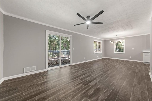 unfurnished living room with a textured ceiling, ceiling fan with notable chandelier, crown molding, and dark wood-type flooring