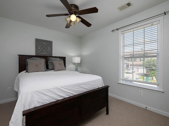 1535 Justine Way SE, Mableton, GA 30126 - carpeted bedroom with multiple windows, baseboards, and a ceiling fan
