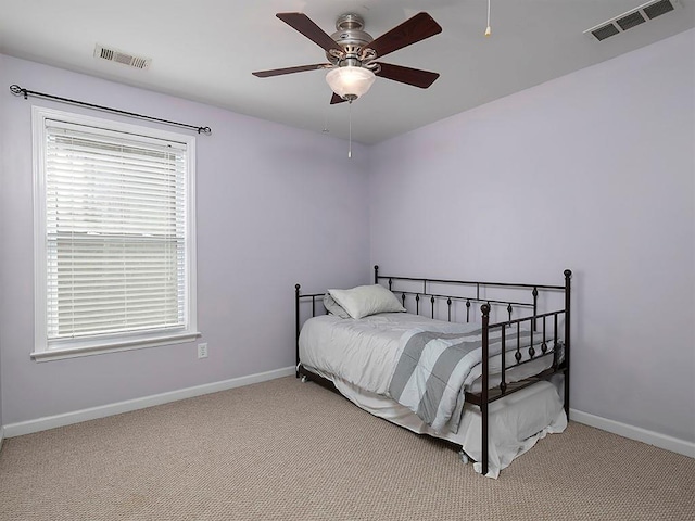 1535 Justine Way SE, Mableton, GA 30126 - carpeted bedroom featuring multiple windows, baseboards, and a ceiling fan