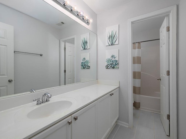 1535 Justine Way SE, Mableton, GA 30126 - full bathroom with vanity, tile patterned floors, and shower / bathtub combination with curtain