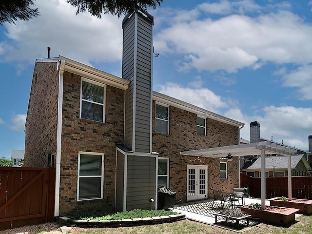 1535 Justine Way SE, Mableton, GA 30126 - rear view of house featuring a chimney, french doors, a patio area, brick siding, and fence