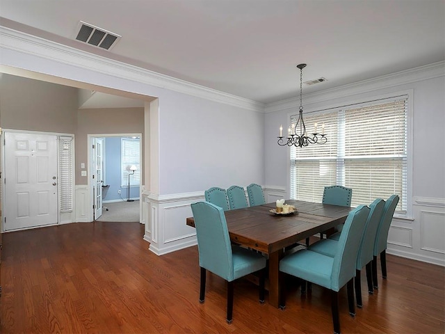 1535 Justine Way SE, Mableton, GA 30126 - dining space featuring a chandelier, a wainscoted wall, a decorative wall, ornamental molding, and dark wood-style floors