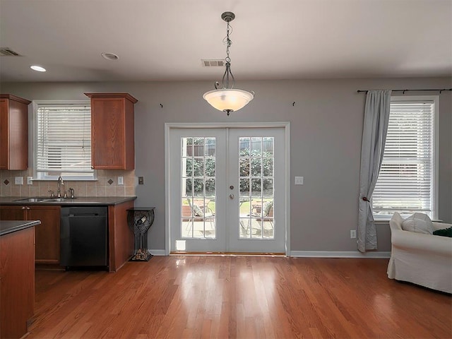 1535 Justine Way SE, Mableton, GA 30126 - kitchen with dishwasher, dark countertops, french doors, light wood-style floors, and recessed lighting