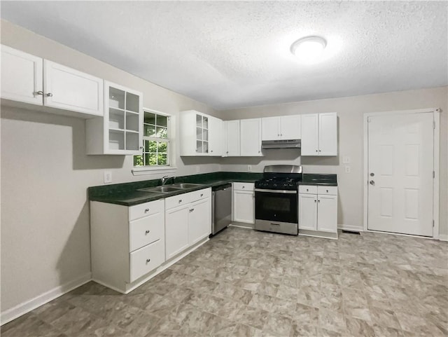 kitchen with sink, stainless steel appliances, a textured ceiling, and white cabinetry