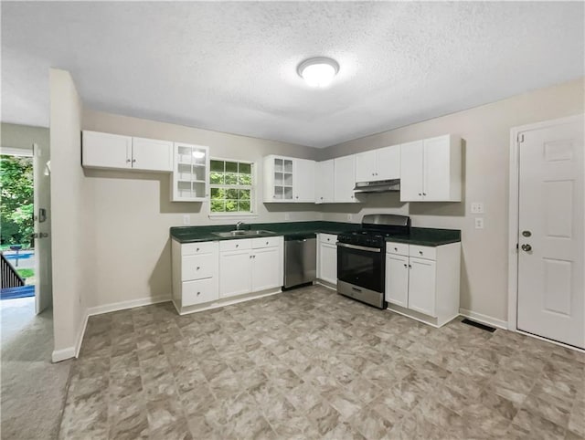 kitchen with sink, white cabinets, and appliances with stainless steel finishes