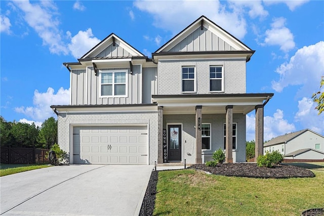 view of front of property featuring a garage and a front yard