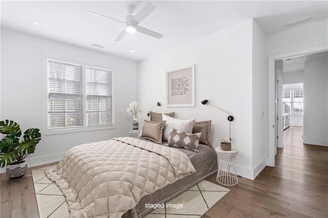 bedroom featuring hardwood / wood-style floors and ceiling fan