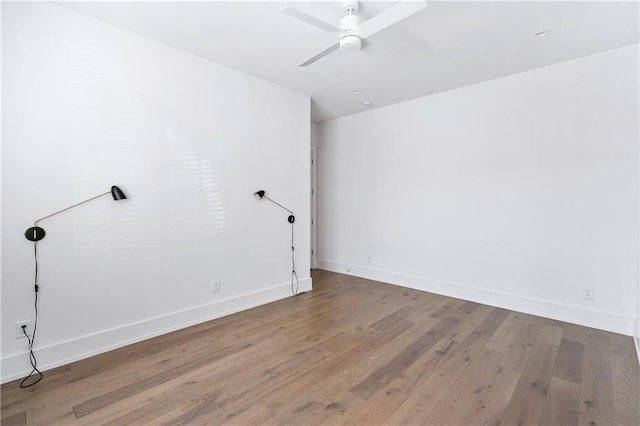 spare room featuring ceiling fan and hardwood / wood-style floors