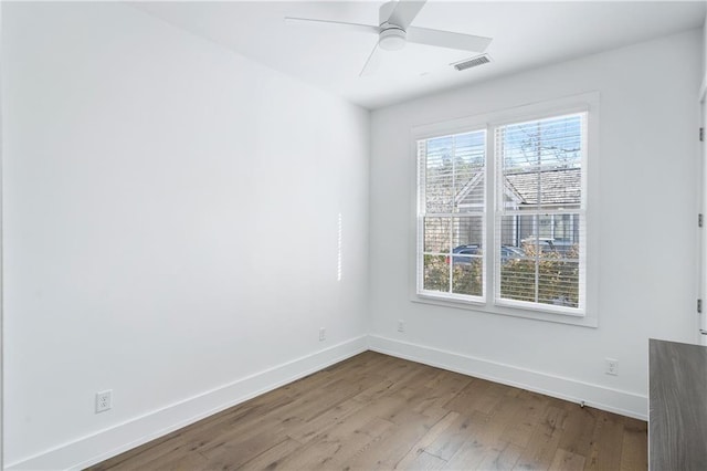 unfurnished room featuring light hardwood / wood-style floors and ceiling fan