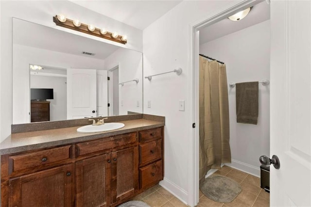 bathroom with vanity, a shower with curtain, and tile patterned floors