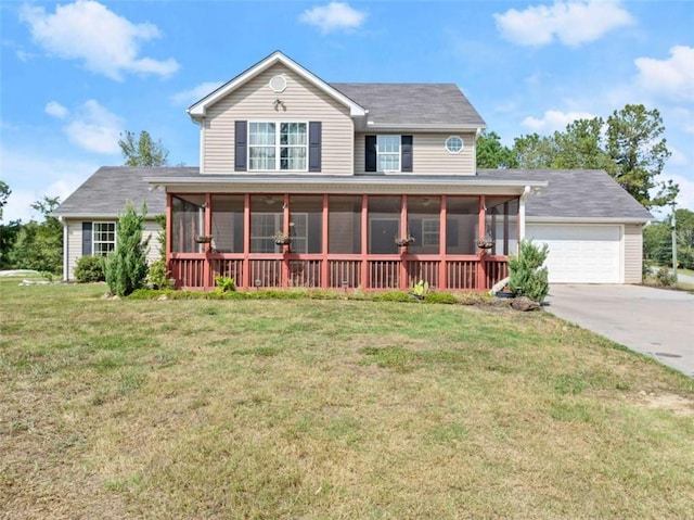 view of front facade featuring a garage, a front lawn, and a sunroom