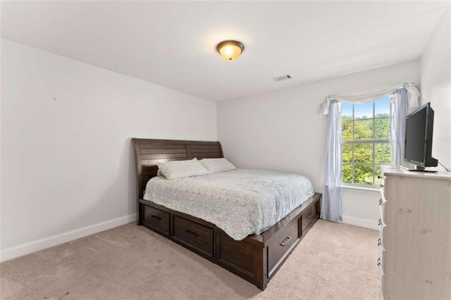 bedroom with light carpet