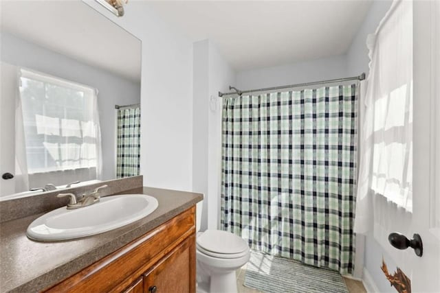 bathroom with vanity, toilet, and a shower with shower curtain