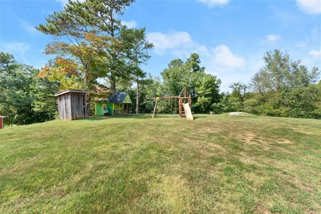 view of yard with a playground and a shed