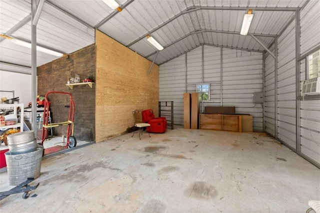 garage with a carport and cooling unit