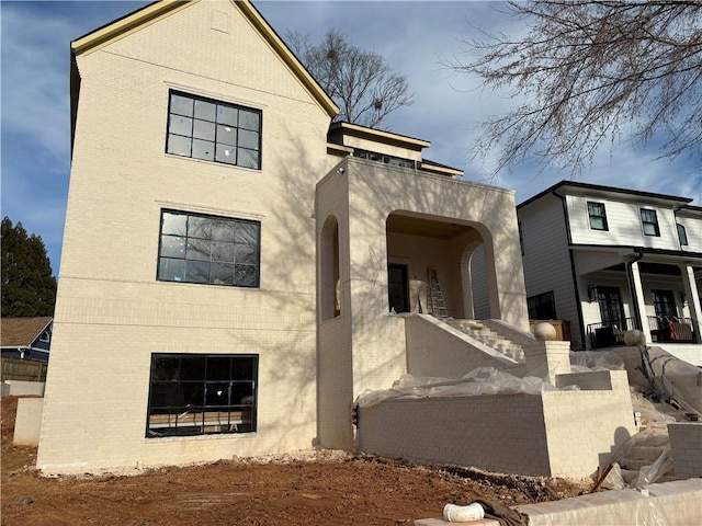 exterior space featuring brick siding