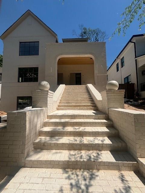 view of front of house with stairs