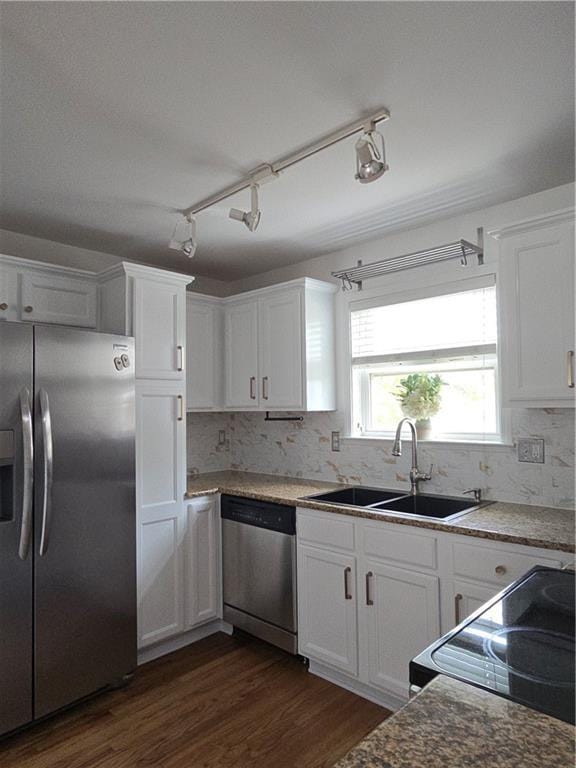 48 Peachtree Ave NE Unit 321, Atlanta, GA 30305 - kitchen with stainless steel appliances, white cabinets, dark wood-type flooring, and backsplash