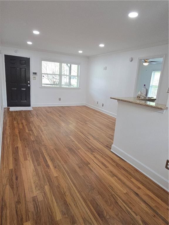 48 Peachtree Ave NE Unit 321, Atlanta, GA 30305 - unfurnished living room with wood finished floors, recessed lighting, and a ceiling fan