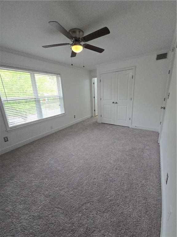 48 Peachtree Ave NE Unit 321, Atlanta, GA 30305 - unfurnished bedroom with carpet, ceiling fan, and a closet