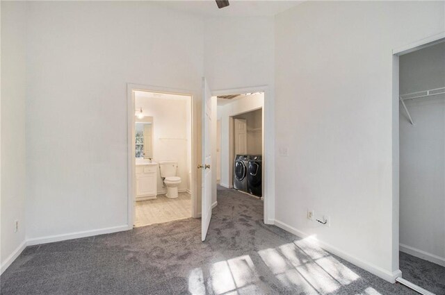 1025 Lakeside Cir, Covington, GA 30016 - unfurnished bedroom featuring baseboards, ensuite bathroom, separate washer and dryer, and carpet