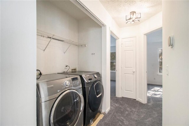 1025 Lakeside Cir, Covington, GA 30016 - laundry room featuring carpet flooring, independent washer and dryer, baseboards, and a textured ceiling