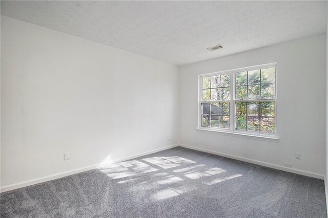 1025 Lakeside Cir, Covington, GA 30016 - carpeted empty room featuring a textured ceiling, baseboards, and visible vents