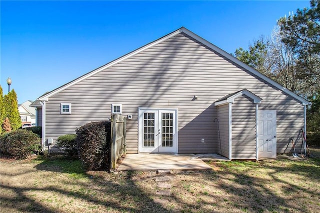 1025 Lakeside Cir, Covington, GA 30016 - rear view of house featuring french doors, a yard, and a patio area