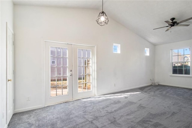 1025 Lakeside Cir, Covington, GA 30016 - empty room featuring carpet flooring, a ceiling fan, french doors, and vaulted ceiling