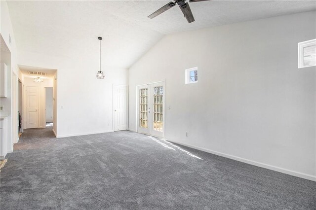 1025 Lakeside Cir, Covington, GA 30016 - spare room featuring high vaulted ceiling, a textured ceiling, dark colored carpet, baseboards, and ceiling fan