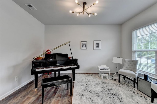 5215 Wheeler Run Dr, Auburn, GA 30011 - sitting room featuring a chandelier, baseboards, and wood finished floors