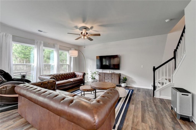 5215 Wheeler Run Dr, Auburn, GA 30011 - living room featuring ceiling fan, wood finished floors, stairs, and baseboards