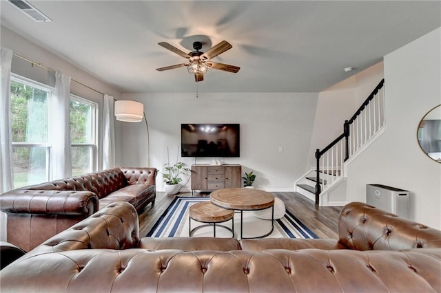 5215 Wheeler Run Dr, Auburn, GA 30011 - living room with ceiling fan, wood finished floors, stairs, and baseboards