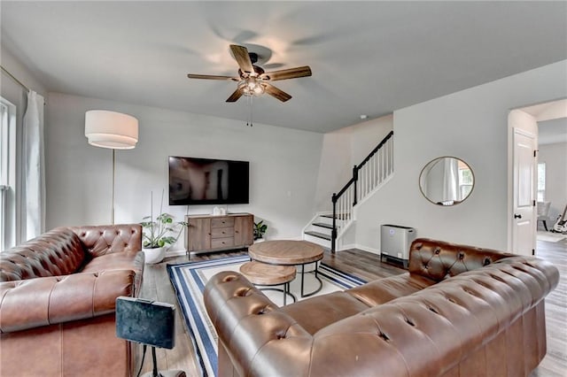 5215 Wheeler Run Dr, Auburn, GA 30011 - living room with a ceiling fan, stairway, wood finished floors, and baseboards